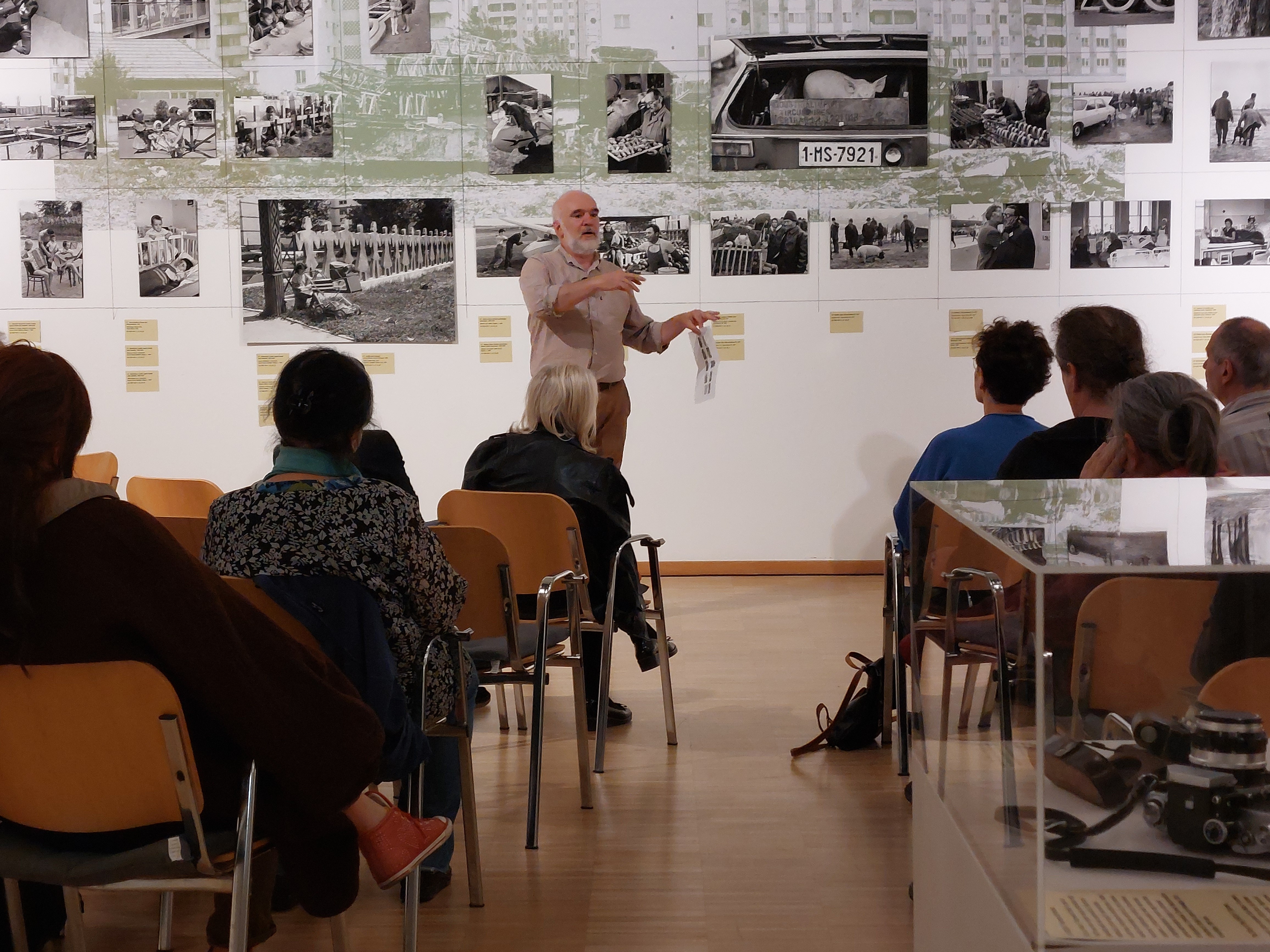 Children playing at a playground in front of a factory building