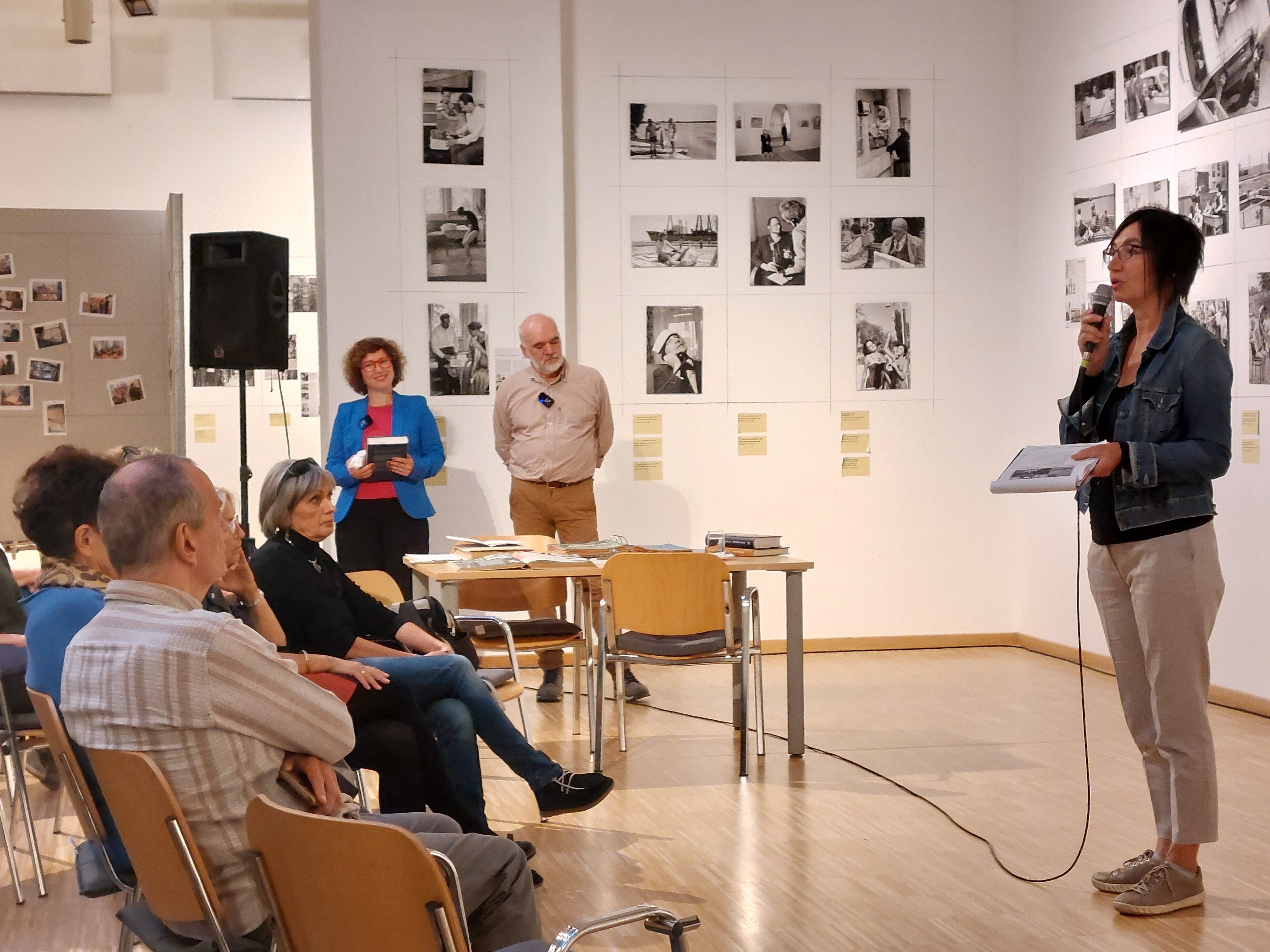 Children playing at a playground in front of a factory building
