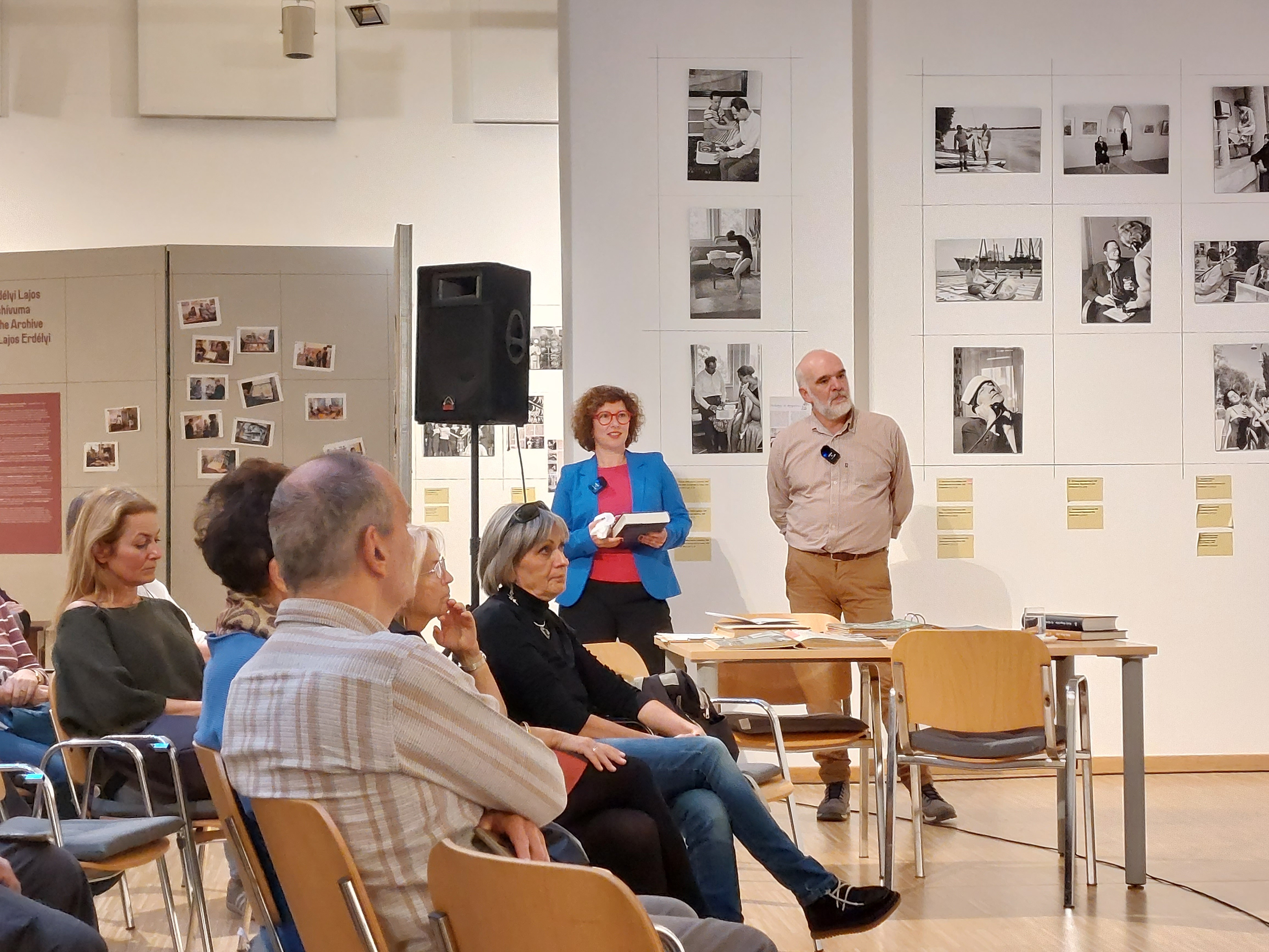 Children playing at a playground in front of a factory building