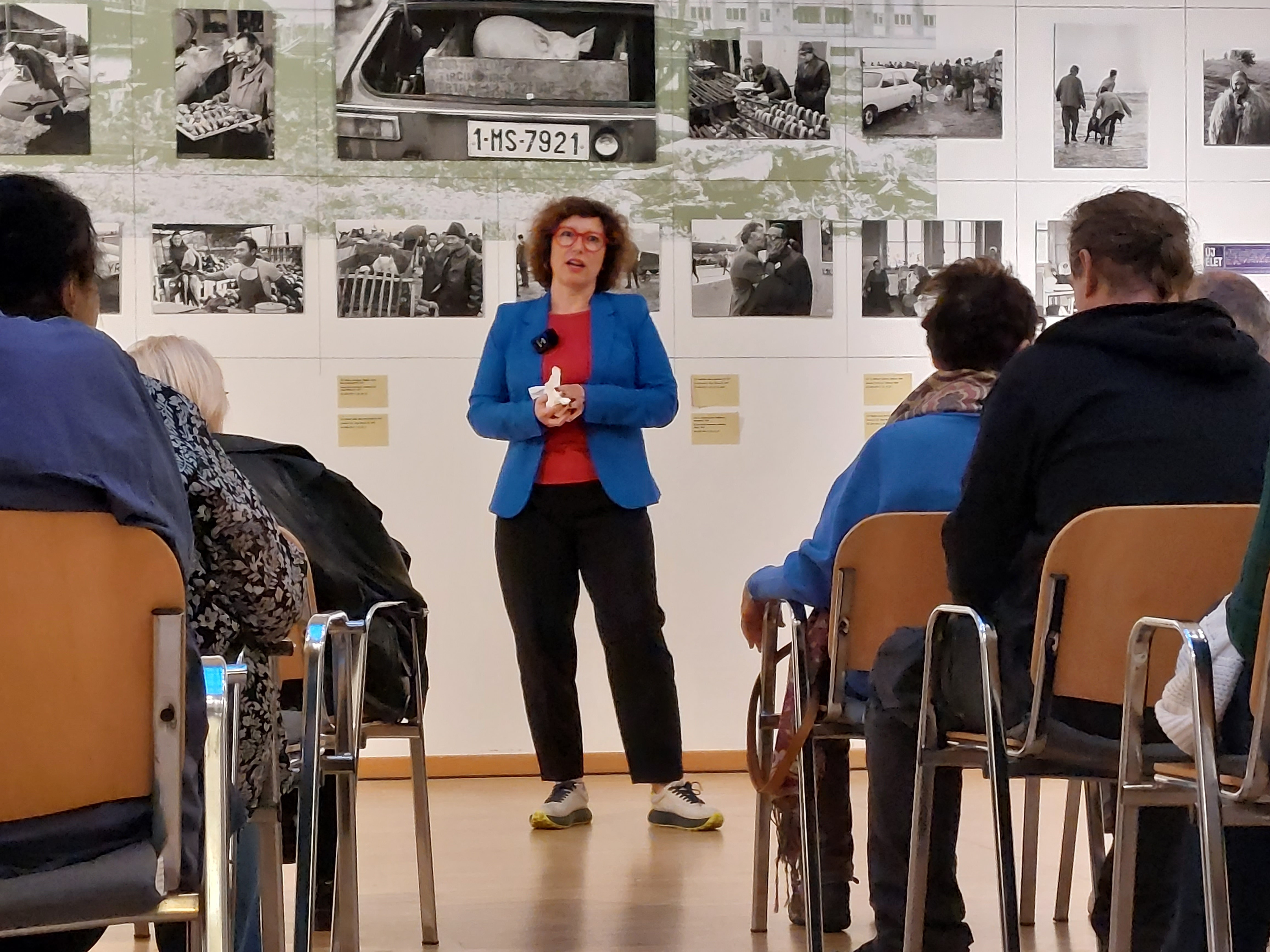 Children playing at a playground in front of a factory building