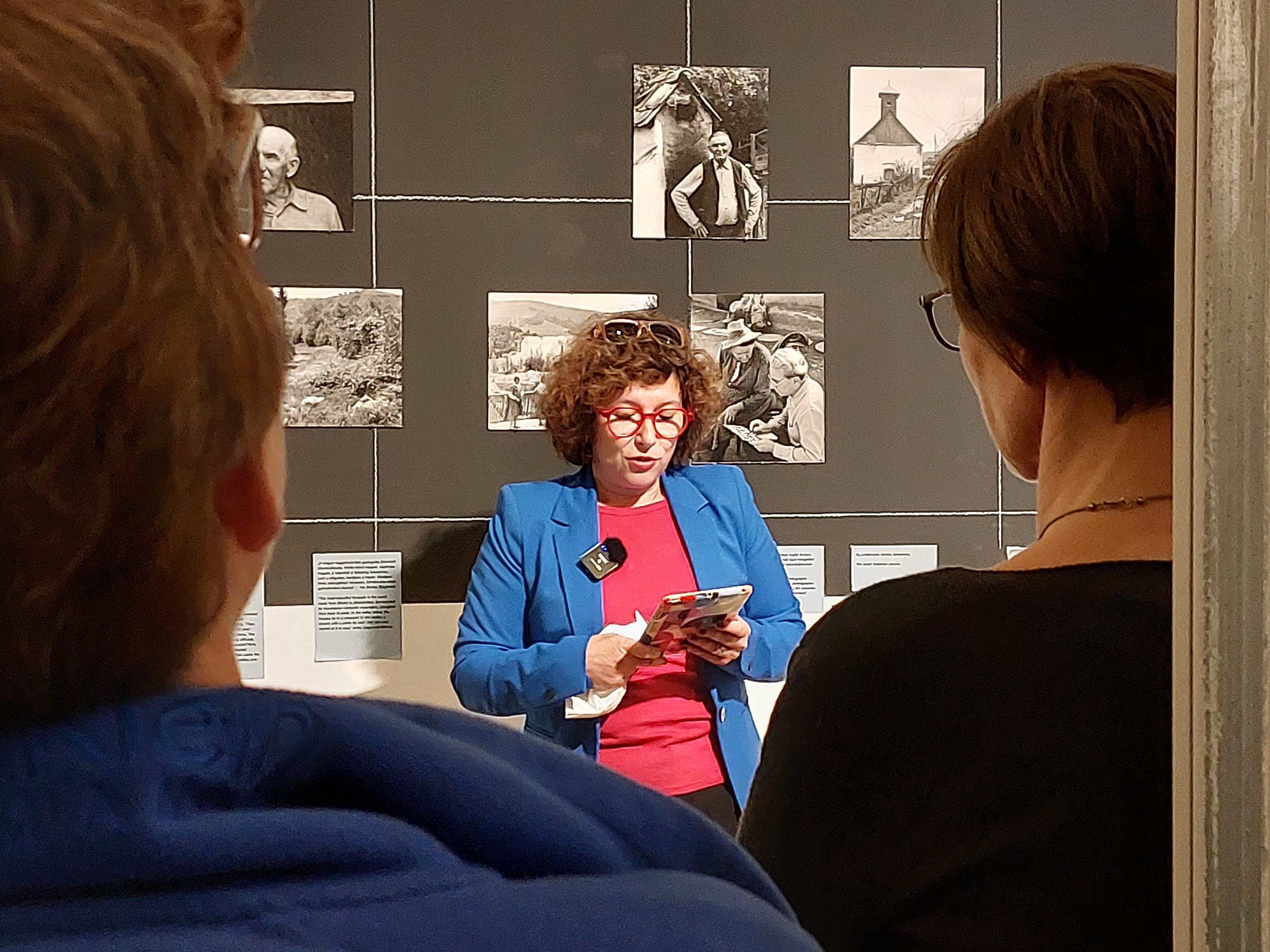 Children playing at a playground in front of a factory building