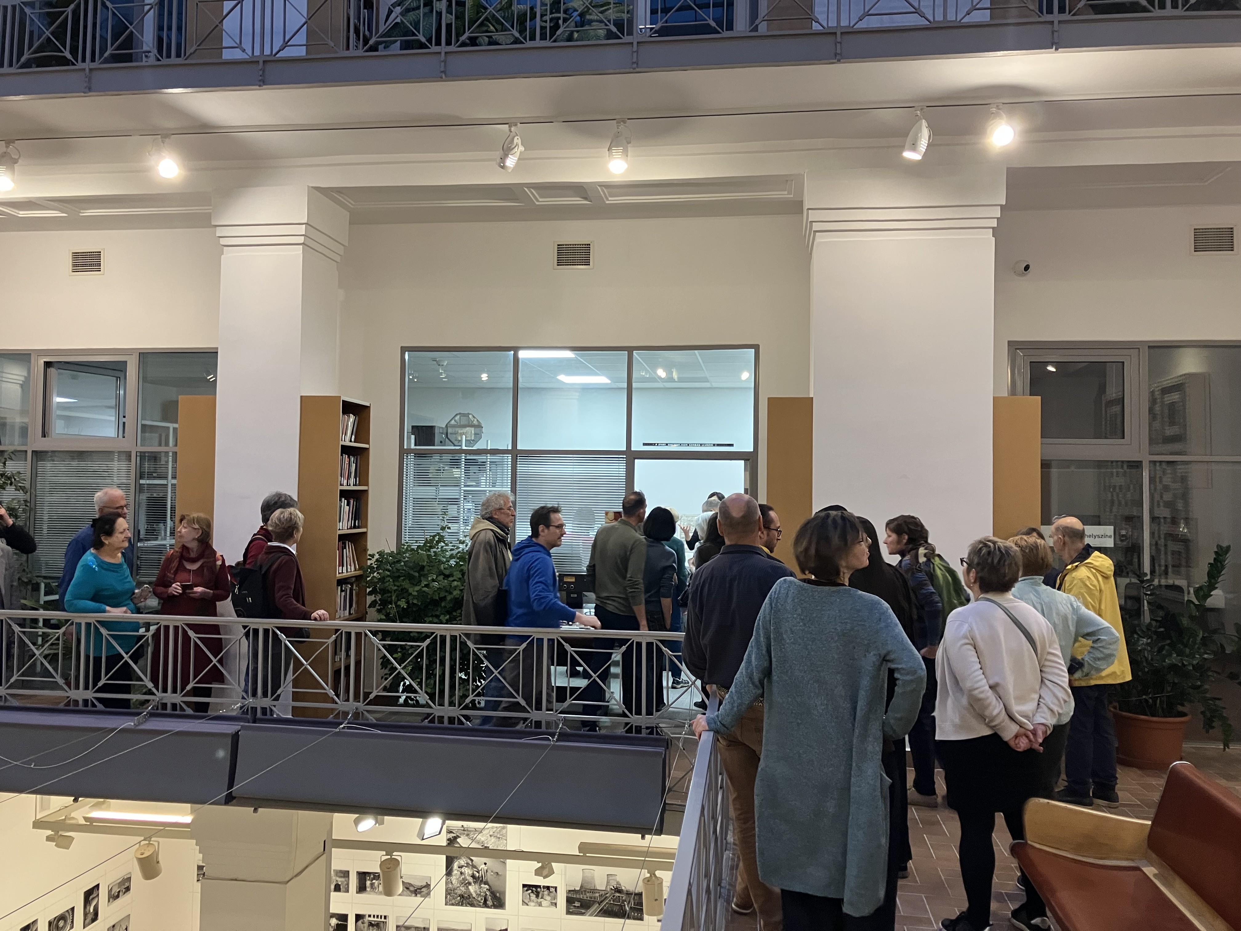Curators Lenke Sziágyi and Zsuzsa Zádori standing in front of the exhibition.