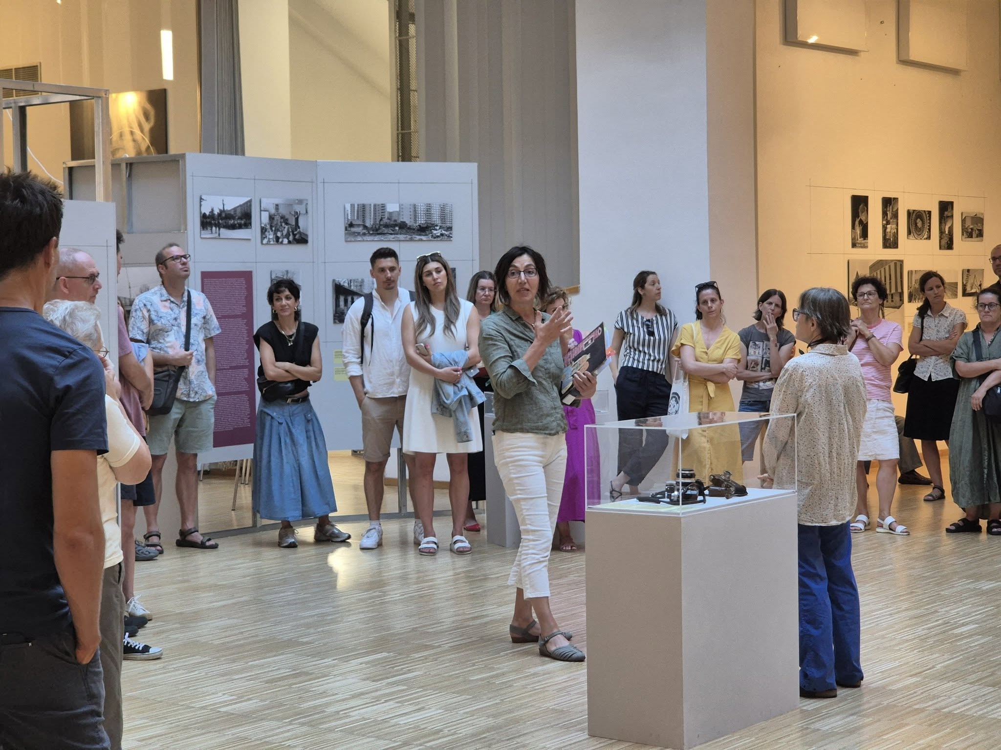 Curators Lenke Sziágyi and Zsuzsa Zádori standing in front of the exhibition.