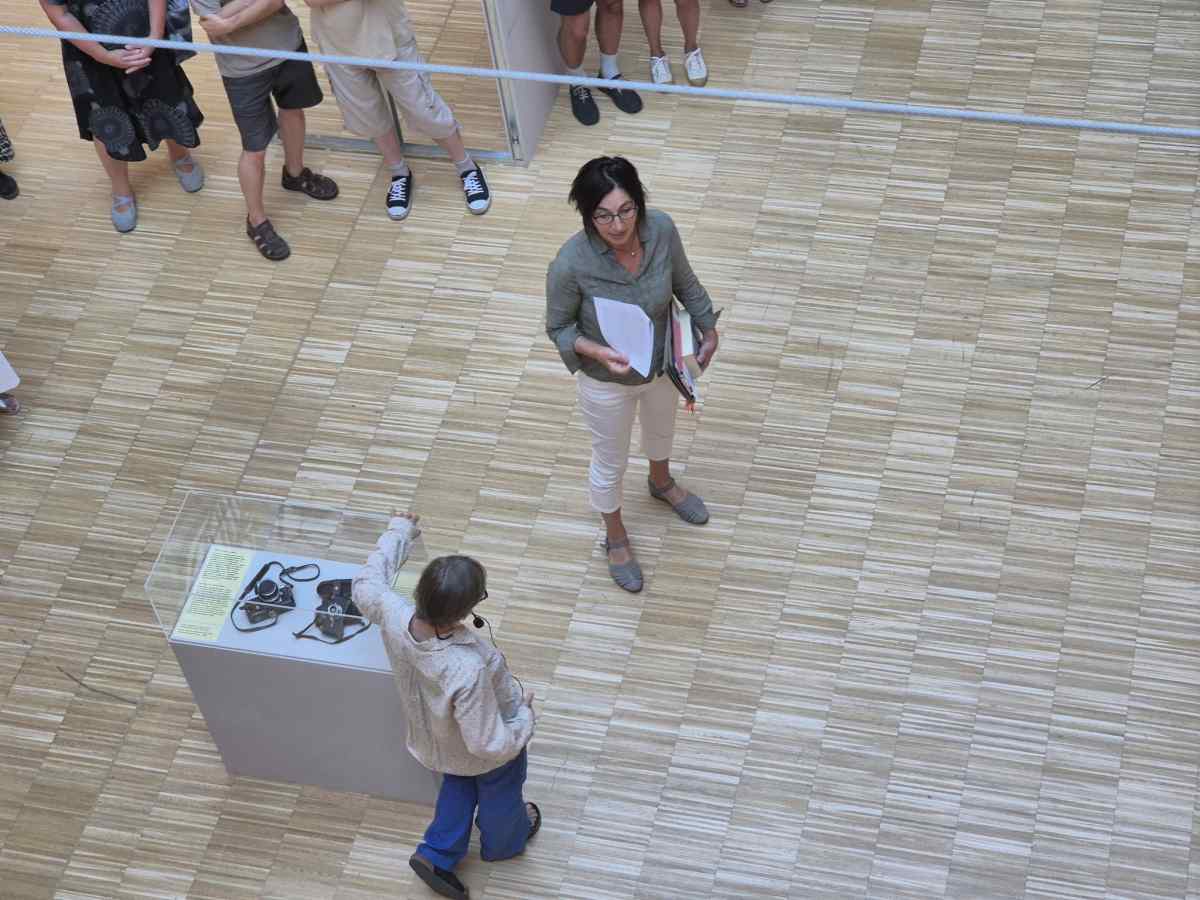 Curators Lenke Sziágyi and Zsuzsa Zádori standing in front of the exhibition.