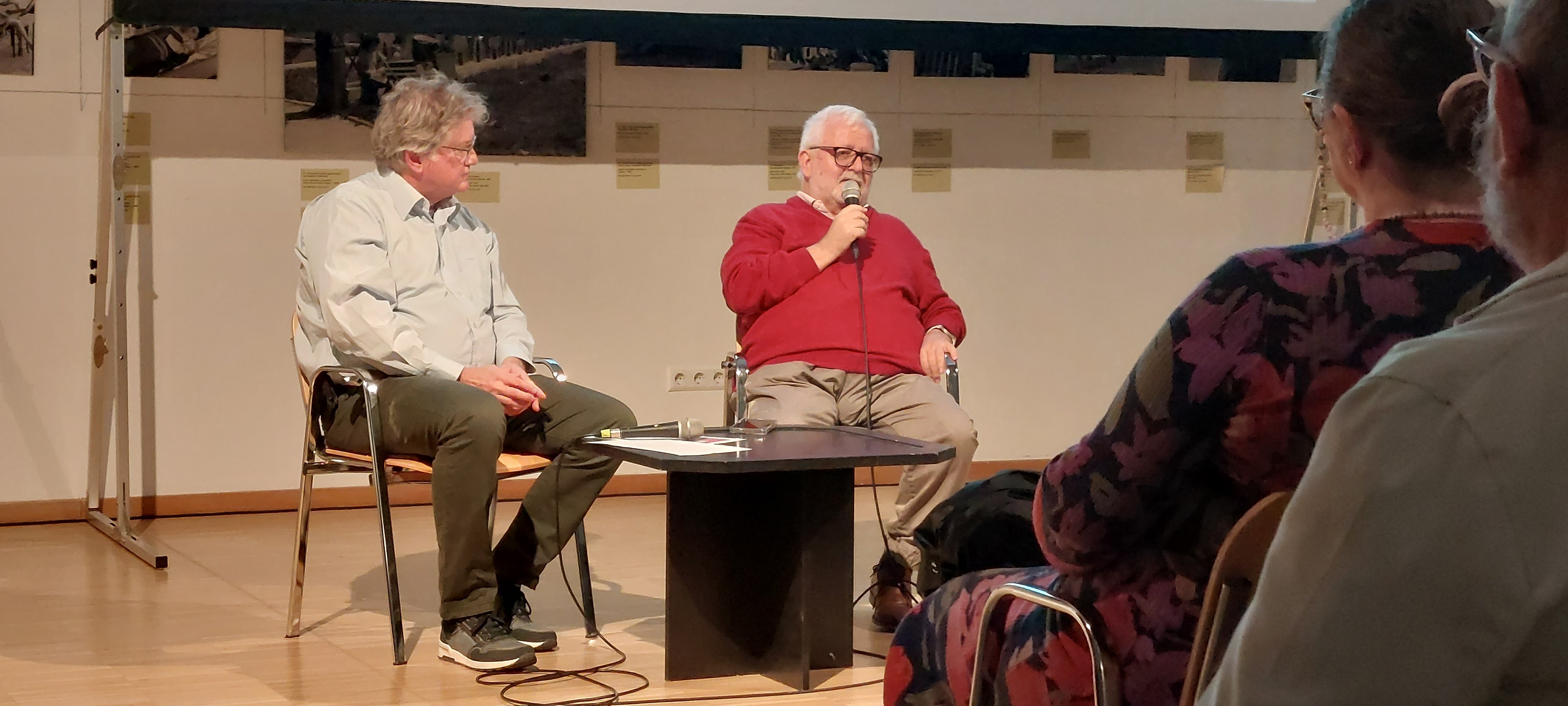 Men in prison uniforms at a court hearing