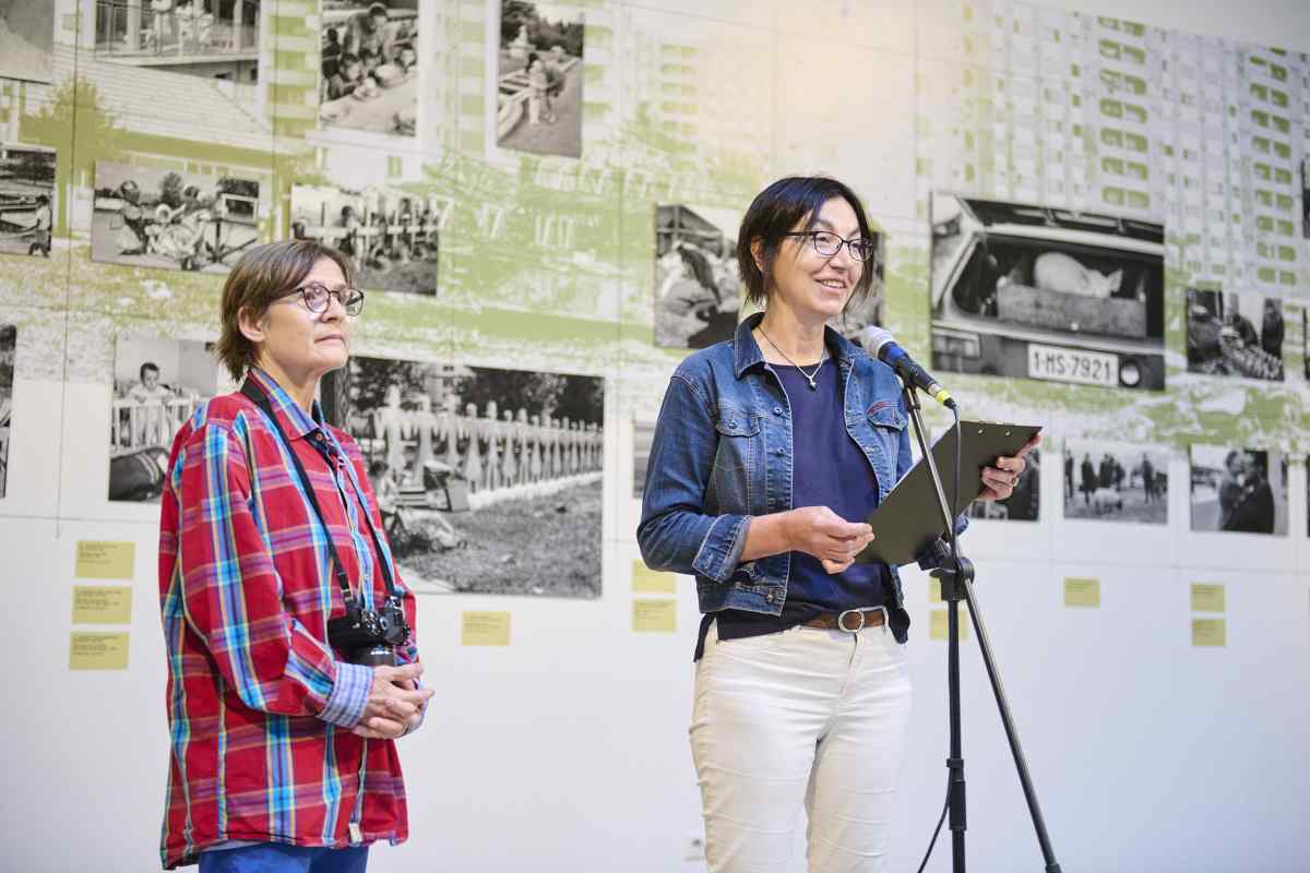 Curators Lenke Sziágyi and Zsuzsa Zádori standing in front of the exhibition.