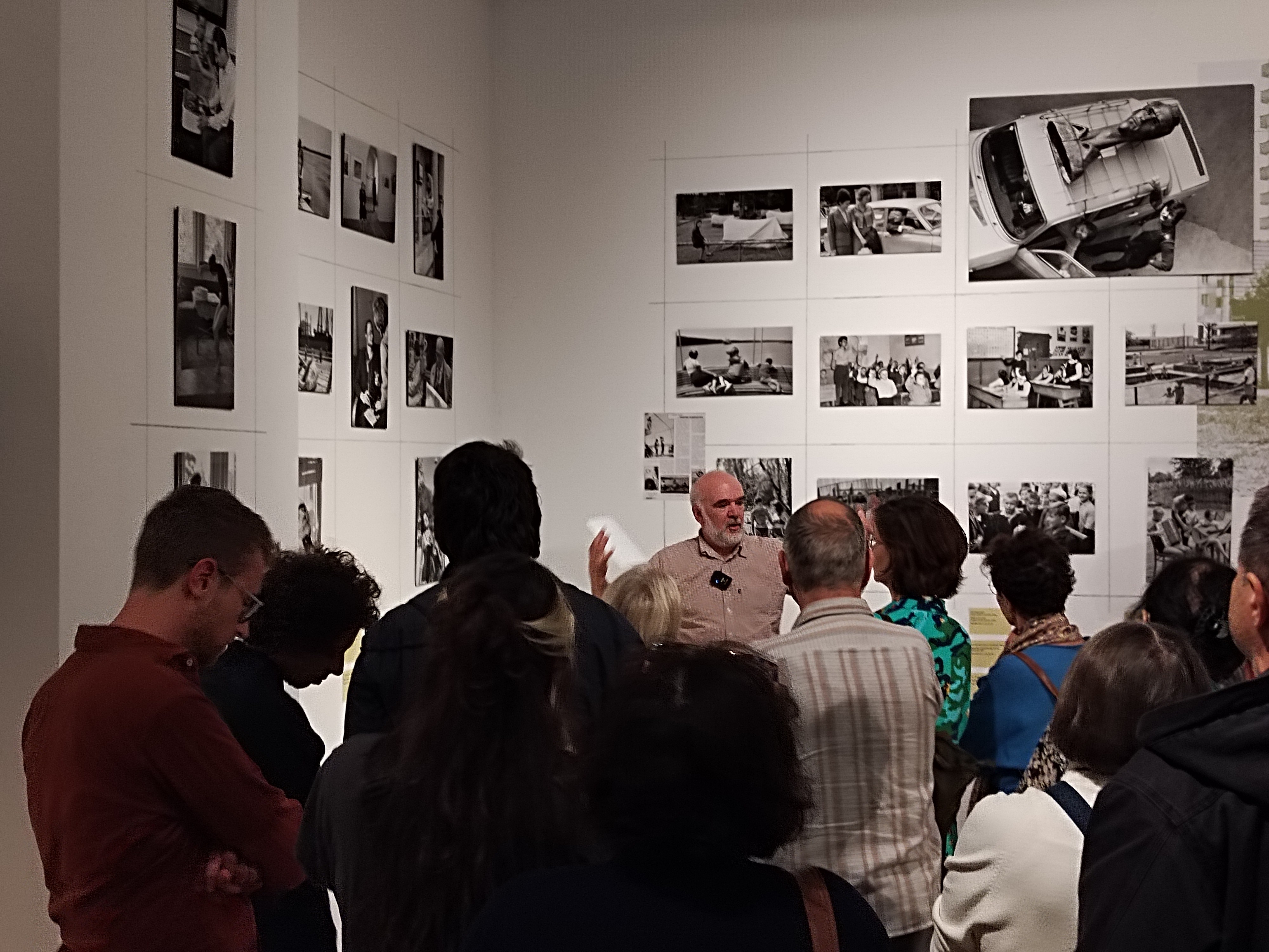 Children playing at a playground in front of a factory building